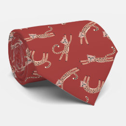Baby Cheetah schneidet rot und rosa Krawatte