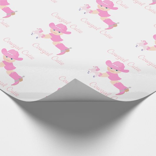 Baby-Cowgirl mit rosa Hut-und Geschenkpapier (Ecke)