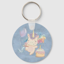 Baby Einhorn mit Regenbogenkissen