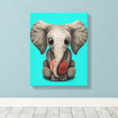 Baby Elephant Playing With Basketball Leinwanddruck (Insitu (Holzboden))