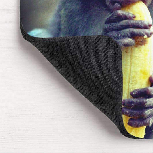 Baby Monkey Eating Banana Mousepad (Ecke)