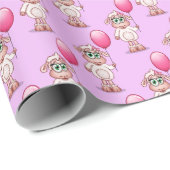 Baby-Schaf-Mädchen, das ein rosa Baloon. hält Geschenkpapier (Rolleneckpunkt)