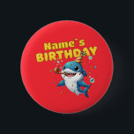Baby Shark Button<br><div class="desc">Make a splash at your little one's birthday party with this adorable Baby Shark design! Featuring a cheerful blue shark wearing a festive party hat and blowing a noisemaker, surrounded by colorful confetti and bubbles. This vibrant, high-quality illustration is perfect for first birthdays, "One-derful" ocean-themed parties, or any toddler who...</div>