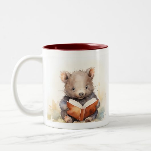 Baby Wombat Reader Keramik Tasse (Links)
