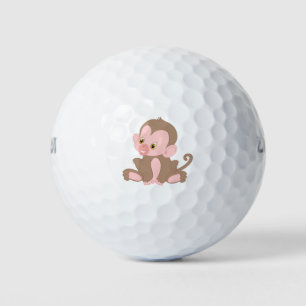 Babyaffe lächeln golfball