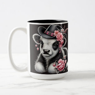 Babykuh mit stillem Hut, geschmückt mit rosa Blüte Zweifarbige Tasse