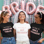 Bachelorette Party Most Likely To Get Married T-Shirt<br><div class="desc">Bring a touch of playful anticipation to the bachelorette festivities with this charming and customizable t-shirt design! Featuring the perfectly fitting phrase "most likely to GET MARRIED" in delicate pink lettering against a crisp white background, this design is both sweet and sassy. It's an ideal choice for the bride-to-be or...</div>