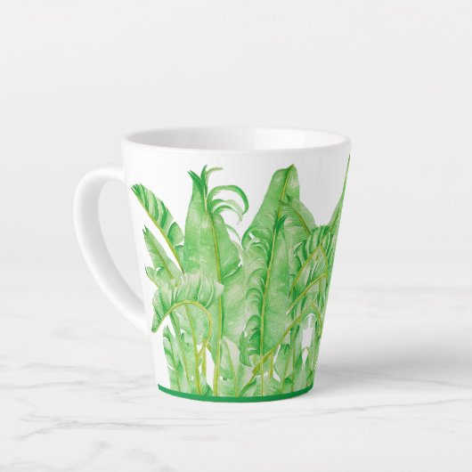 Banana-Blätter auf einer kleinen Latte-Tasse Milchtasse (Linke Ecke)