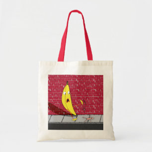 Banane, die auf einer Personen-Tasche gleitet Tragetasche