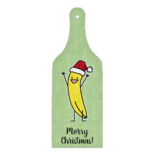 Bananen-Weihnachtsmannmütze-zujubelnder Schneidebrett