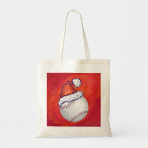 Baseball mit Weihnachtsmannmütze auf Rot Tragetasche
