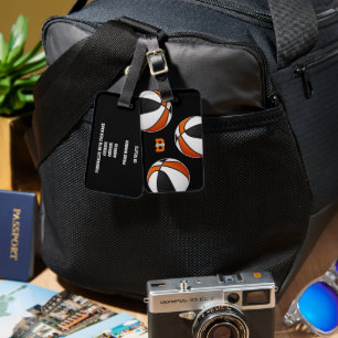 Basketballsportler in schwarz-orangefarbenen Manns Gepäckanhänger