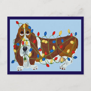 Basset Hound in Weihnachtslichter verheddert Feiertagspostkarte