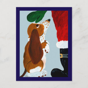Basset-Welpe bekommt ein Haustier von Santa Postkarte