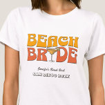 Beach Junggeselinnen-Abschied Retro Groovy Beach B T-Shirt<br><div class="desc">Lassen Sie sich mit diesem atemberaubenden Junggeselinnen-Abschied am Strand, personalisierten T - Shirt, von Ihrem bevorstehenden Junggeselinnen-Abschied verwöhnen. Ob Sie einen Badeurlaub, einen Mädchenurlaub oder einen Junggeselinnen-Abschied der besten Freunde verbringen möchten, diese T - Shirt sind die perfekte Ergänzung zu Ihrem unvergesslichen Aufenthalt. Fügen Sie Ihrem Junggeselinnen-Abschied eine persönliche Touch...</div>