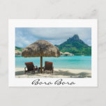 Beach on Bora Bora white Postcard Postkarte<br><div class="desc">Postcard with a thatched parasol and two sunlounger chairs on white sand beach in a luxury overwater bungalow resort in the clear blue lagoon of the pacific island of Bora Bora,  near Tahiti in French Polynesia with a white border and text: Bora Bora.</div>