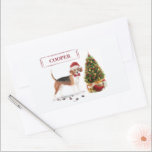 Beagle Funny Christmas Dog mit Baum Rechteckiger Aufkleber<br><div class="desc">Ein niedlicher Beagle trägt ein Weihnachtskleid humorvoll. Mit Blick auf einen Baum verließ er kalte Pfoten. "Paws" und schicken lustige Weihnachtsgeschenke.</div>