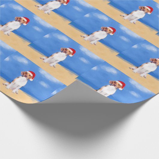 Beagle Hund sitzend am Weihnachtshut am Strand Geschenkpapier (Ecke)