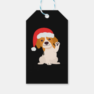 Beagle Welpe mit dem Hut des Weihnachtsmannes für Geschenkanhänger