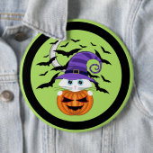 Beängstigender Kürbis mit einem weißen Kätzchen un Button (Beispiel)