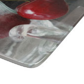 Becher mit Kirschen Schneidebrett (Ecke)