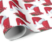 Becher mit Weihnachtsmannmütze und Band aus rotem Geschenkpapier (Rolleneckpunkt)