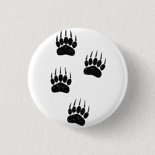 Bedrucktes Papier mit bedrängten Schwarz Bär Tatze Button