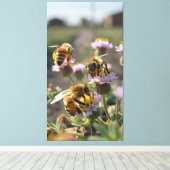 Bees collect pollen from wildflowers on the farm leinwanddruck (Insitu (Holzboden))