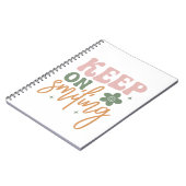 Behalt auf dem Lächeln inspirierender Zitate Notizblock (Linke Seite)