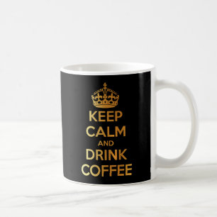 Behalten Sie ruhiges und Getränkkaffeegold und Kaffeetasse