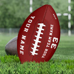 Benutzerdefiniert Red Football mit Name Team Name<br><div class="desc">Benutzerdefinierter Red Football mit Name, Nummer und Teamname. Personalisieren Sie es mit Ihrem Namen, Teamname, Nummer und Jahr - optional. Der Text ist eine trendige weiße Typografie auf einem roten Hintergrund. Sie können jeden Text auf dem Fußball ändern oder löschen. Ein perfektes Geschenk für Fußballspieler, Teamkollegen, Trainer, Freunde und Familie....</div>