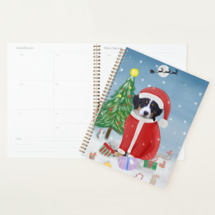 Berner Sennenhund im Schnee mit Weihnachtsgeschenk Planer