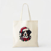 Bernese Hund mit Weihnachtsmannmütze und Florals Tragetasche (Vorne)