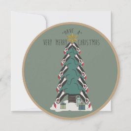 Besondere Pinguine hängen um den Weihnachtsbaum he Feiertagskarte