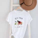 Beste Mama-Ever | Trendy Burgundy Boho Floral T-Shirt<br><div class="desc">Dieses trendige und stilvolle Shirt sagt "Beste Mama aller Zeiten" in rustikaler,  handgeschriebener Schrift und verfügt über ein Aquarellbouquet mit bohfarbigen Blume in Marsala-,  Orange- und Weißtönen für ein Geschenk,  das Ihre Mutter Liebe wird.</div>