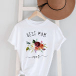 Beste Mama je | Trendy Burgundy Boho Floral T-Shirt<br><div class="desc">Dieses trendige und stilvolle Shirt sagt "Beste Mutter aller Zeiten" in rustikaler,  handgeschriebener Schrift und bietet ein Aquarellbouquet mit bohfarbigen Blume in Marsala-,  Orange- und Weißtönen für ein Geschenk,  das Ihre Mutter Liebe wird.</div>