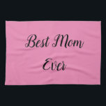 Beste Mutter je Text pink Geschirrtuch<br><div class="desc">"Beste Mama je",  elegant in einem lebendigen Schriftart umrahmt,  hebt sich vor einem weichen rosa Hintergrund ab und verleiht den hochgeehrten Matriarchis ein herzliches Lob in einem kühnen und liebevollen Design.</div>