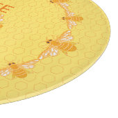 Bienenhonig-Bienen auf gelben Waben Schneidebrett (Ecke)