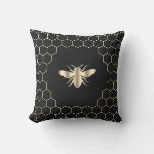 Bienenwabenhexagons auf schwarz kissen