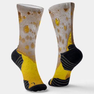 Bierglas mit Bläschen und Schaumstoff Socken