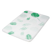 Bieten Sie grüne Blätter auf Weiß an Badematte (Schrägansicht)