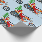 Biker Santa auf einem Chopper mit einem Weihnachts Geschenkpapier (Ecke)