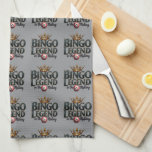 Bingo Legend Crowned in Gold Retro Typography Geschirrtuch<br><div class="desc">Celebrate your love for bingo with this bold and regal design featuring the phrase "Bingo Legend in the Making" in striking retro typography, topped with an ornate golden crown. The deep, rich hues and vintage aesthetic give this artwork a timeless appeal, perfect for those who enjoy the thrill of the...</div>
