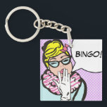 BINGO Schlüsselanhänger<br><div class="desc">B-I-N-G-O! BINGO! Dieses Comic Buch inspiriert BINGO Schlüsselanhänger ist sicher, ein Lächeln auf das Gesicht eines jeden Bingo Liebhaber bringen. Das Design zeigt eine wunderbar eigenartige Frau mit blonden Haaren, die mit einem rosa Bogen auf dem Kopf gepolstert ist, Katzenaugengläser, einem rosa und weißen Zebrastreifen und blauem Kleid. Eine weiße...</div>