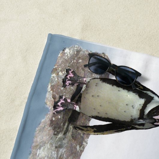 Birnen aus schwarzem und weißem Pinguin auf blauem Strandtuch (Beispiel)