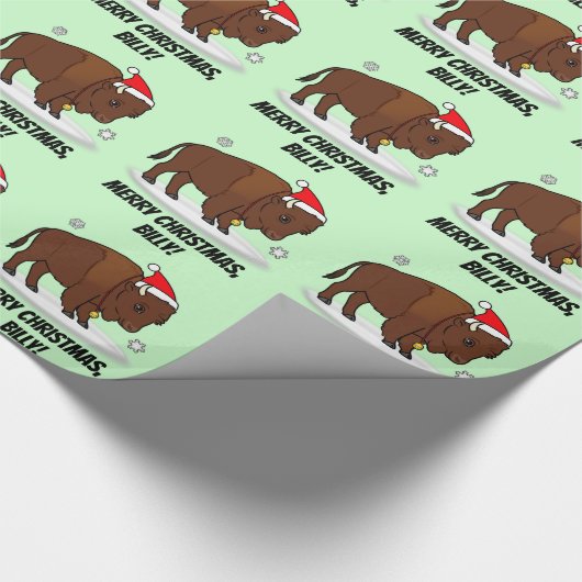 Bison in einer Weihnachtsmannmütze am Geschenkpapier (Ecke)