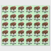 Bison in einer Weihnachtsmannmütze am Geschenkpapier (Flach)
