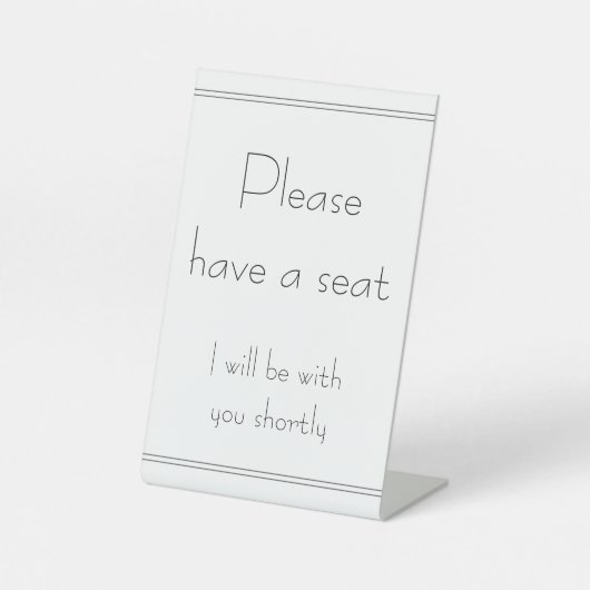 "Bitte nehmen Sie Platz" "Ich werde in Kürze bei I Sockelschild (Vorderseite)