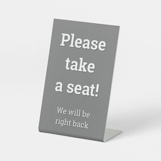 "Bitte setzen Sie sich!" Sockelschild (Vorderseite)