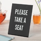 BITTE SITZEN SOCKELSCHILD (In Situ)